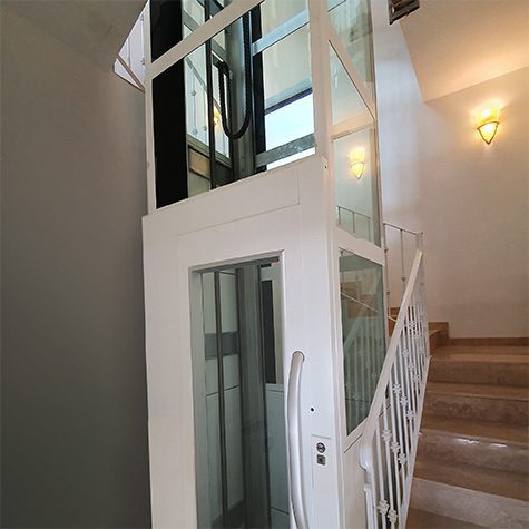 the Cibes lift fits perfectly in the centre of a spiral staircase of an old traditional home, installed in Malta